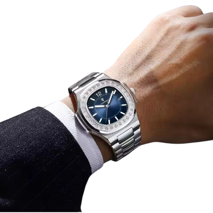 Luxury Boujee Ice watch with blue dial on a person's wrist against a white background